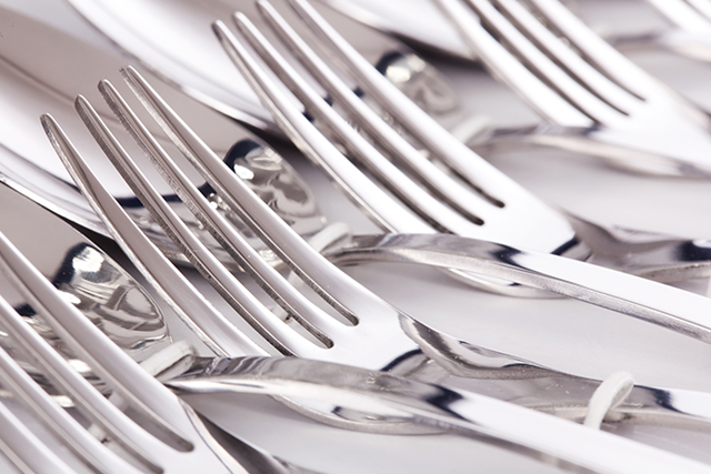 Sterling silver flatware set with hallmark stamps visible